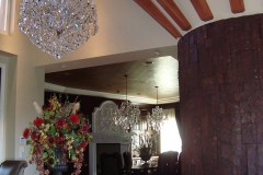Kitchen entry, wood beams on ceiling with chandelier